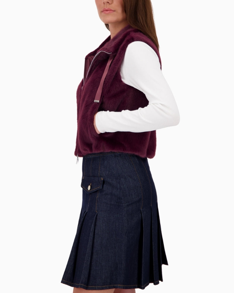 Side view of Taupe faux fur vest by Monari with stand-up collar and soft, fluffy texture