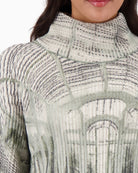 Close-up of gallery print and soft knit texture with lurex detail
