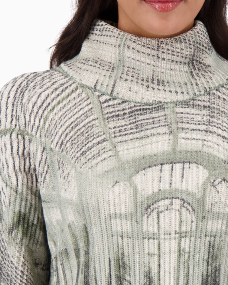 Close-up of gallery print and soft knit texture with lurex detail