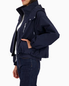 Monari navy hooded jacket, woman wearing side view – Áines Boutique