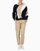 Model wearing Monari sweater styled casually with jeans