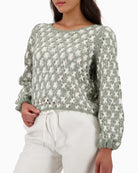 Front view of wool blend jumper with subtle sequins and round neckline