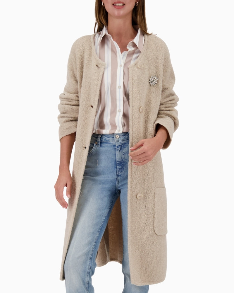 Monari long beige knit coat with elegant brooch fastening