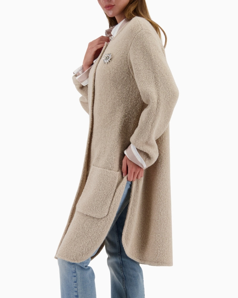 Side view of Monari knit coat showing longline cut and relaxed fit
