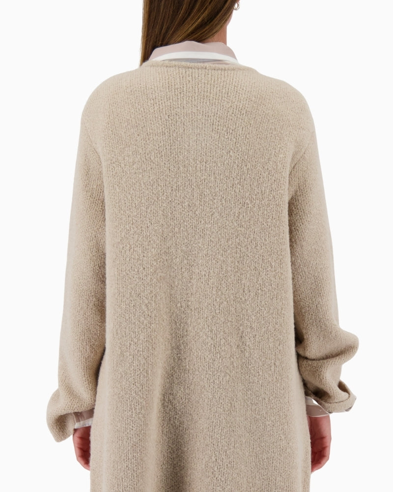 Back view of long beige cardigan with clean finish