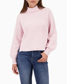 Woman wearing Monari rose knit pullover front view with stand-up collar – Áines Boutique
