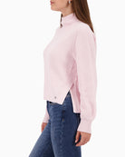 Woman wearing Monari rose knit pullover side view showing side slits – Áines Boutique