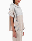 Side view of relaxed-fit cape with soft drape and open front