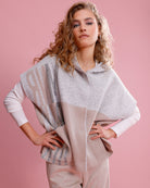Elegant knitted cape by Monari for layering in cool weather