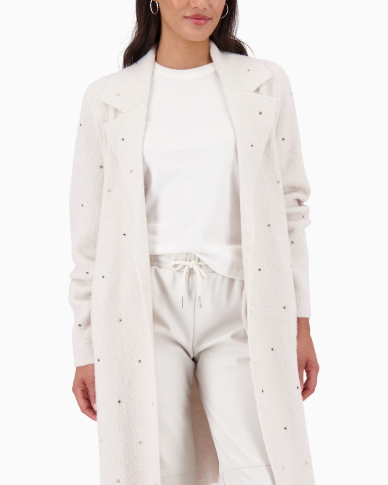 Front view of soft knit coat in neutral tone with side pockets