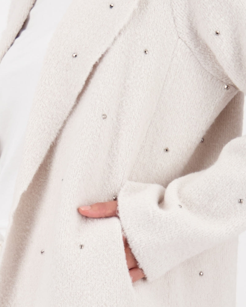 Close-up of stud detail on lapel and wool-viscose fabric texture