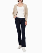 Model wearing Monari sequin throw styled over casual outfit