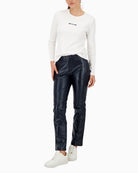 Model wearing navy Monari trousers styled with knitwear and loafers
