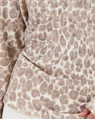 Close-up of gathering detail on soft knit fabric