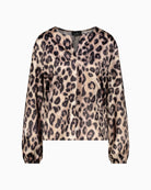 Detail of neckline and shoulder seam on printed blouse