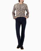 Model wearing Monari jacket styled casually with trousers
