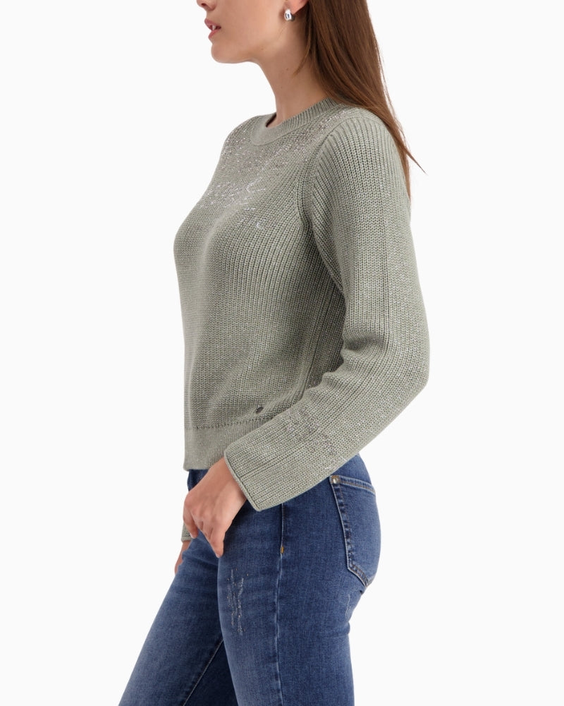 Side view of Monari jumper showing sleeve lettering and relaxed fit