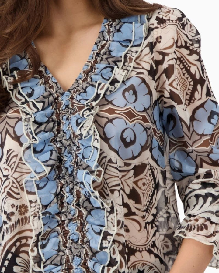 Close-up Monari Ornament Pattern Blouse with gathered V-neck and ruffle front