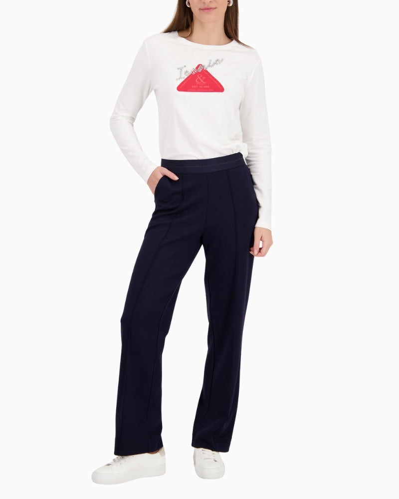 Woman wearing Monari glitter stripe pants navy styled casually – Áines Boutique