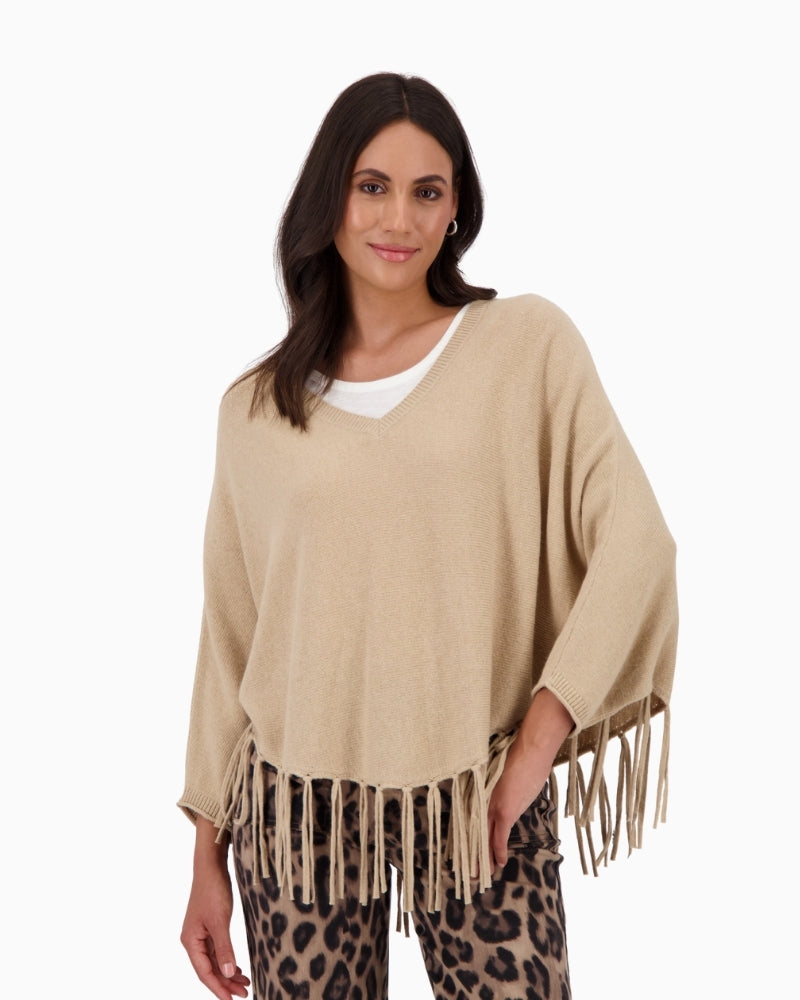 Front view of Monari oversized poncho with V-neck and fringe hem