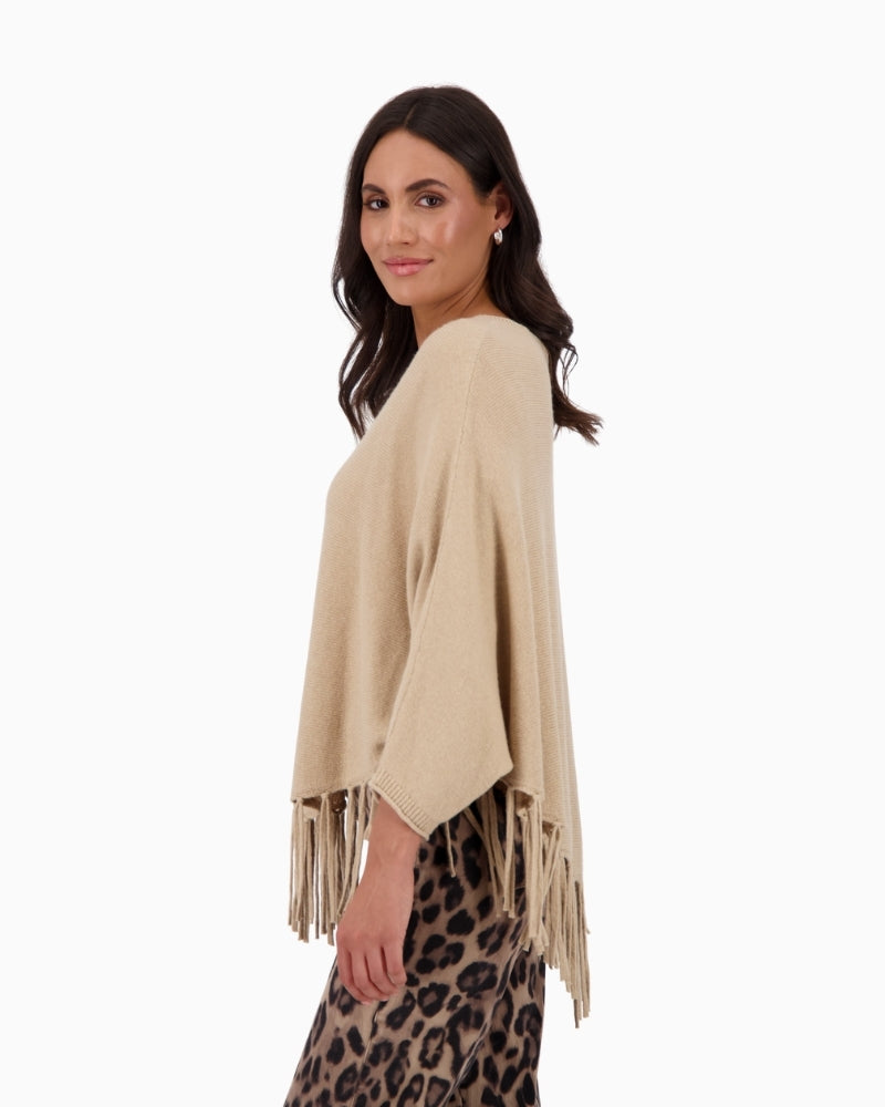 Side profile showing flowing fit and ¾ sleeves