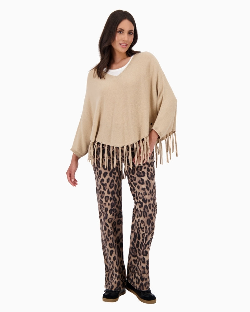 Front view of Monari oversized poncho with V-neck and fringe hem