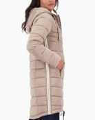 Side view of Lurex stripe and Monari logo patch on sleeve of quilted coat