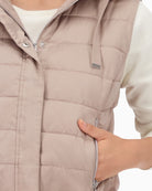 Detail of zip and button placket on lightweight polyester vest