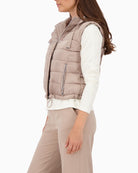 Side view of Monari quilted gilet with zip pockets and drawstring hood