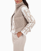 Side view of reversible vest showing soft faux fur texture