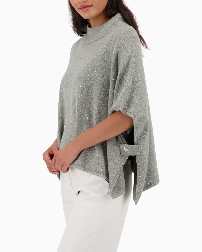 Side view of Monari sequin cape showing oversized shoulder design