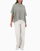 Monari soft sparkle cape in sage for layering over evening looks