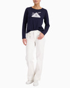 Woman wearing Monari straight-leg jeans with charms off white styled casually – Áines Boutique