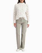 Front view of dark jeans with side pockets and pressed crease