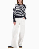 Woman wearing Monari striped jumper navy and off white styled casually – Áines Boutique