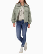 Long-sleeve tweed jacket with snap-close hand pockets in neutral tones