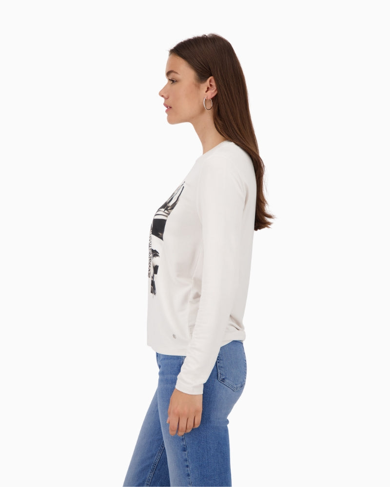 Side view of beige collage shirt with long sleeves