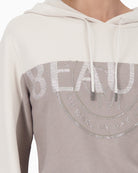 Close-up of rhinestone embellishment and fine knit