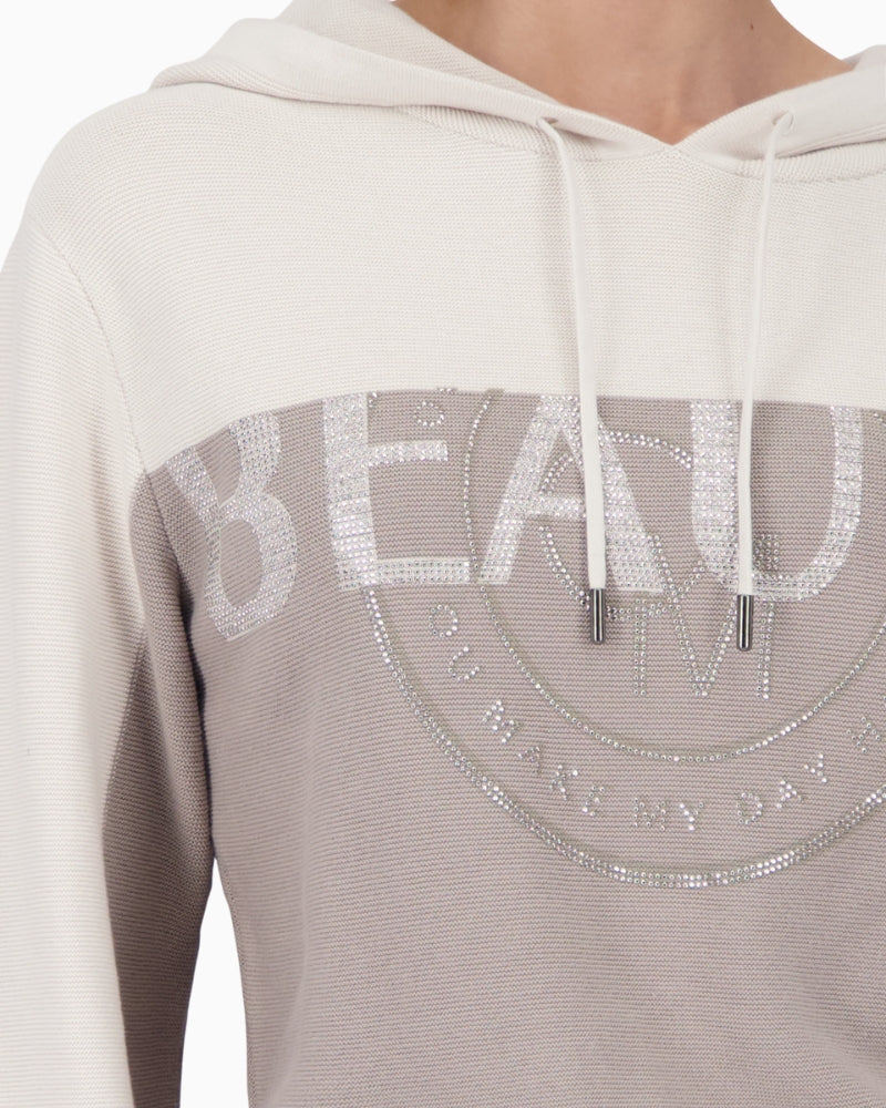 Close-up of rhinestone embellishment and fine knit