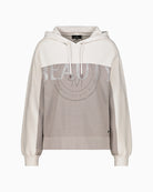 Front view of knitted hoodie with drawstring hood and long sleeves