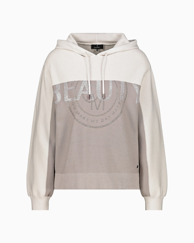 Front view of knitted hoodie with drawstring hood and long sleeves