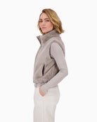 Side view of sleeveless grey gilet showing soft texture and regular fit