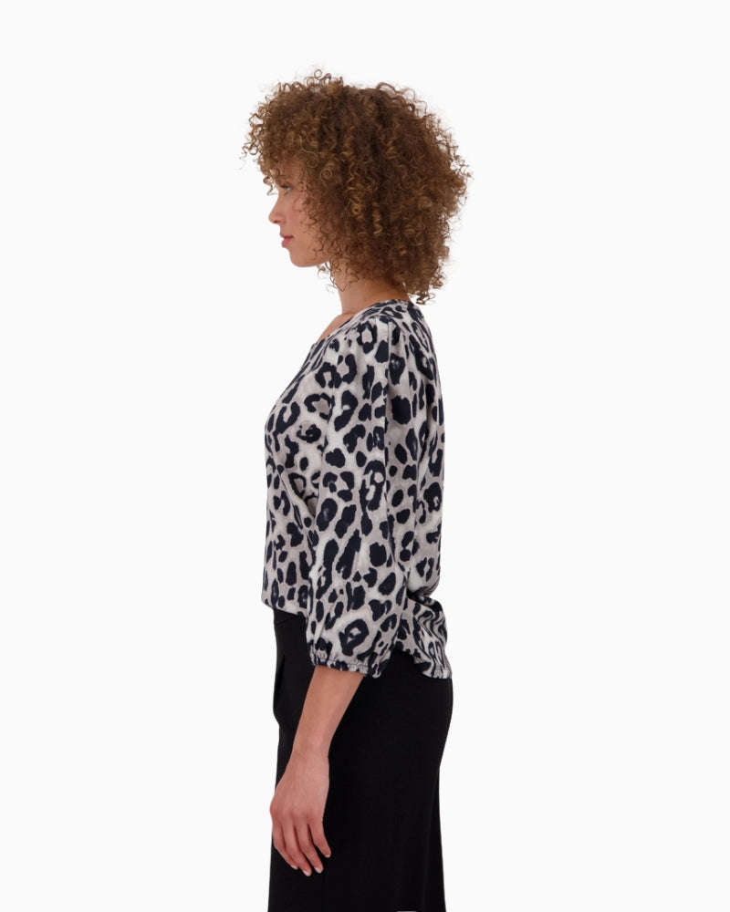 Side view showing length and relaxed sleeve shape
