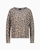 Round neckline and long sleeves with subtle metallic shimmer