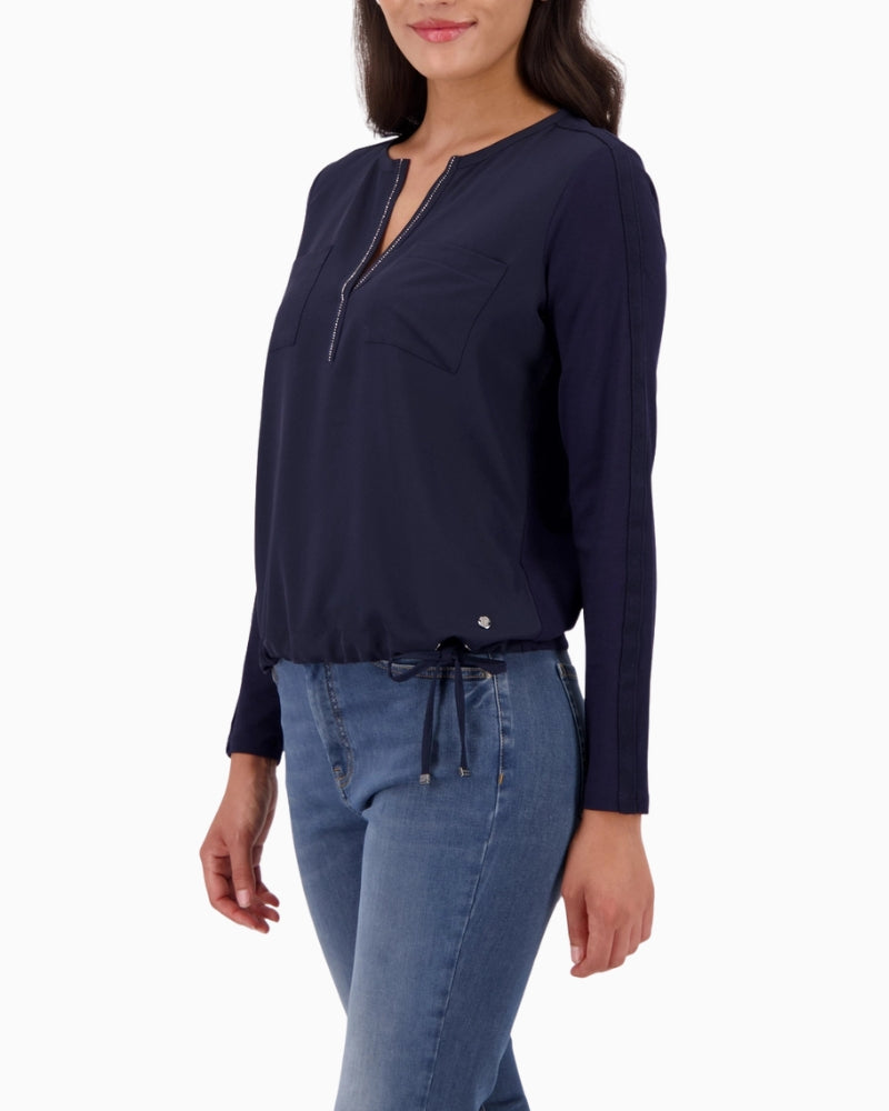 Sleeve detail showing contrast stripe on Monari navy blouse