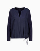 Front pockets and satin finish on Monari navy blouse