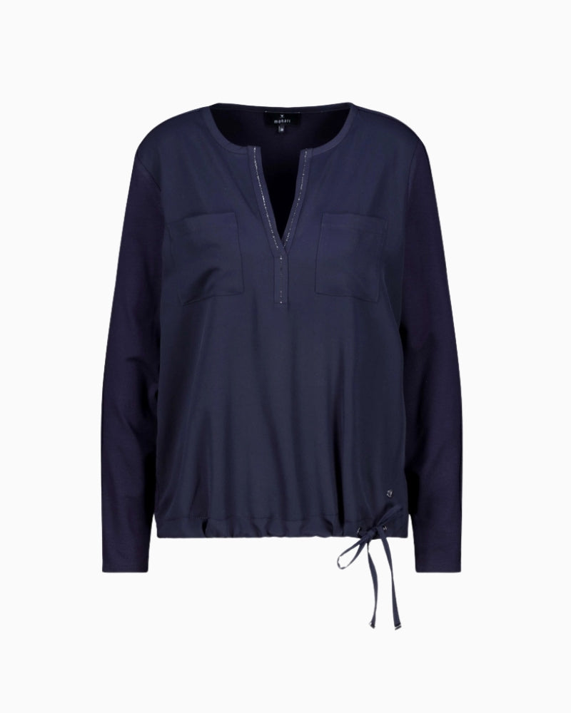 Front pockets and satin finish on Monari navy blouse