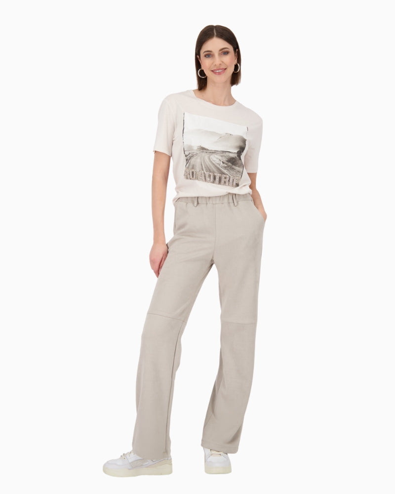 Model wearing beige Monari t-shirt with casual jeans