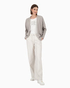 Model wearing grey Monari cardigan over plain top and trousers