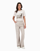 Monari trousers styled casually with shirt and trainers